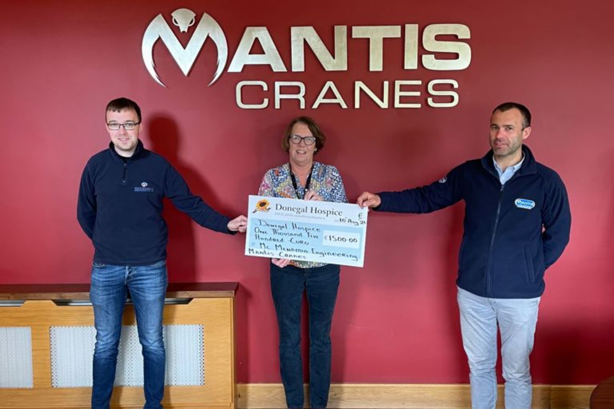 Mantis Cranes and McMenamin Engineering present a cheque to Donegal Hospice