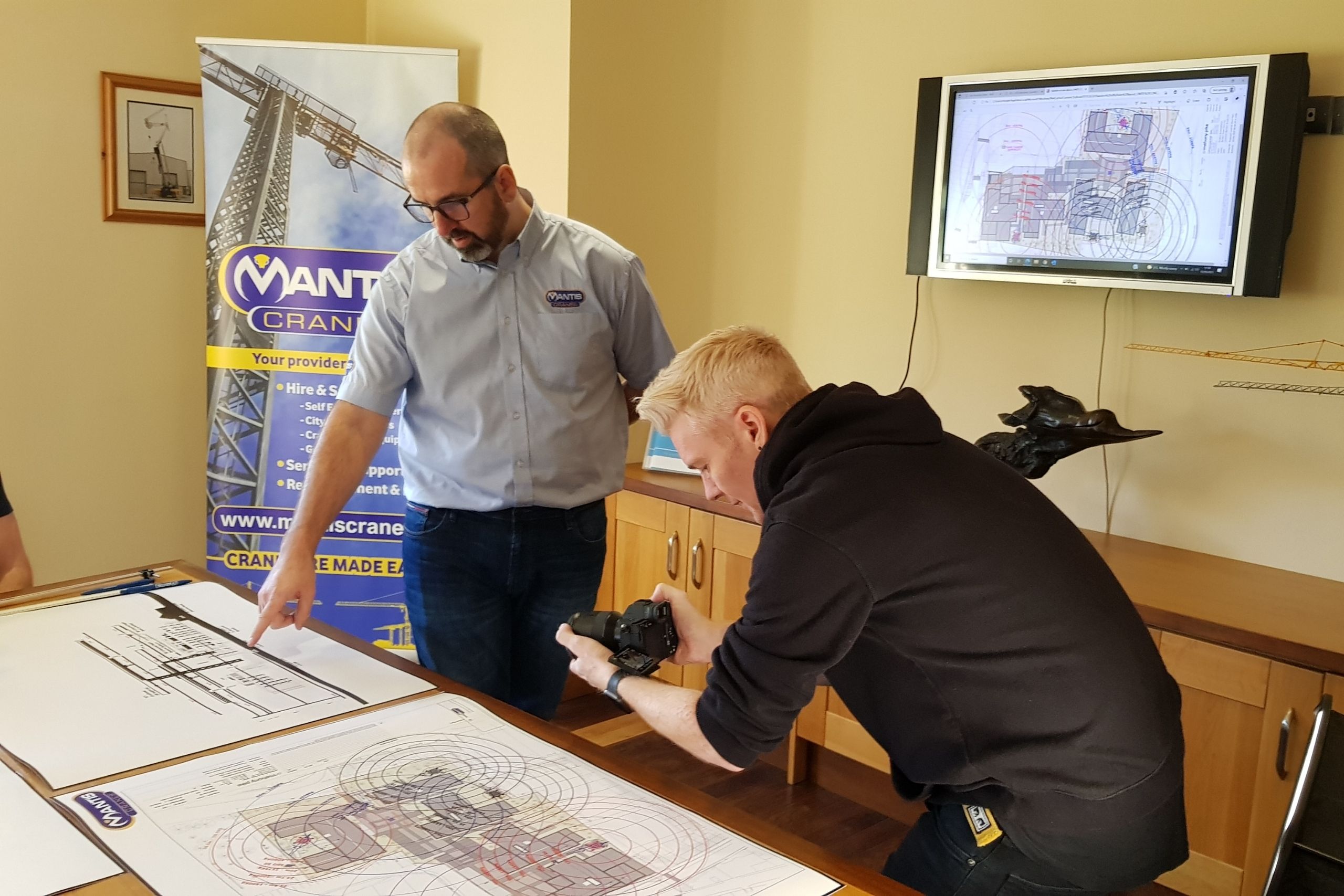 Mantis Cranes boardroom with a site plan for a pedestrian operated tower crane