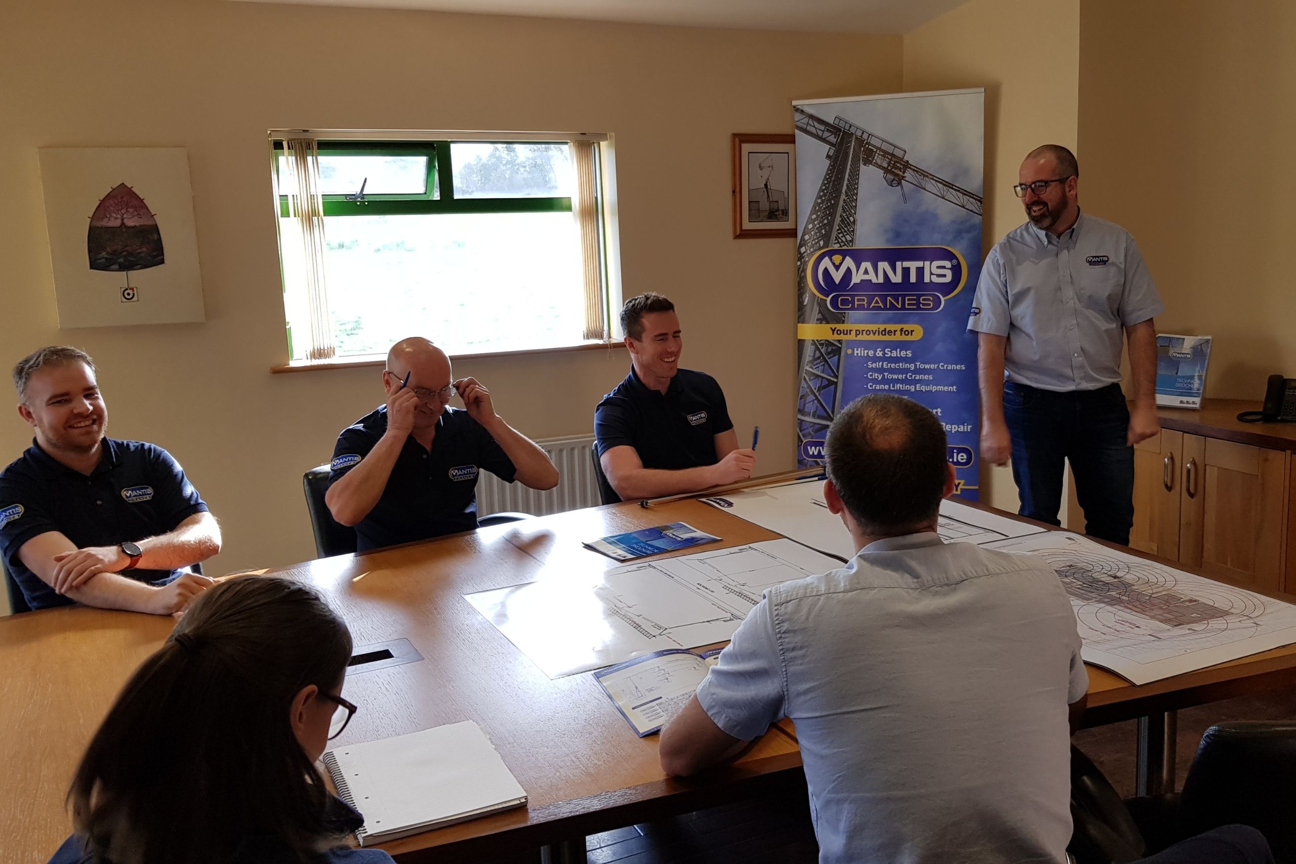 Mantis Cranes boardroom with staff at planning meeting for crane sales UK and Ireland