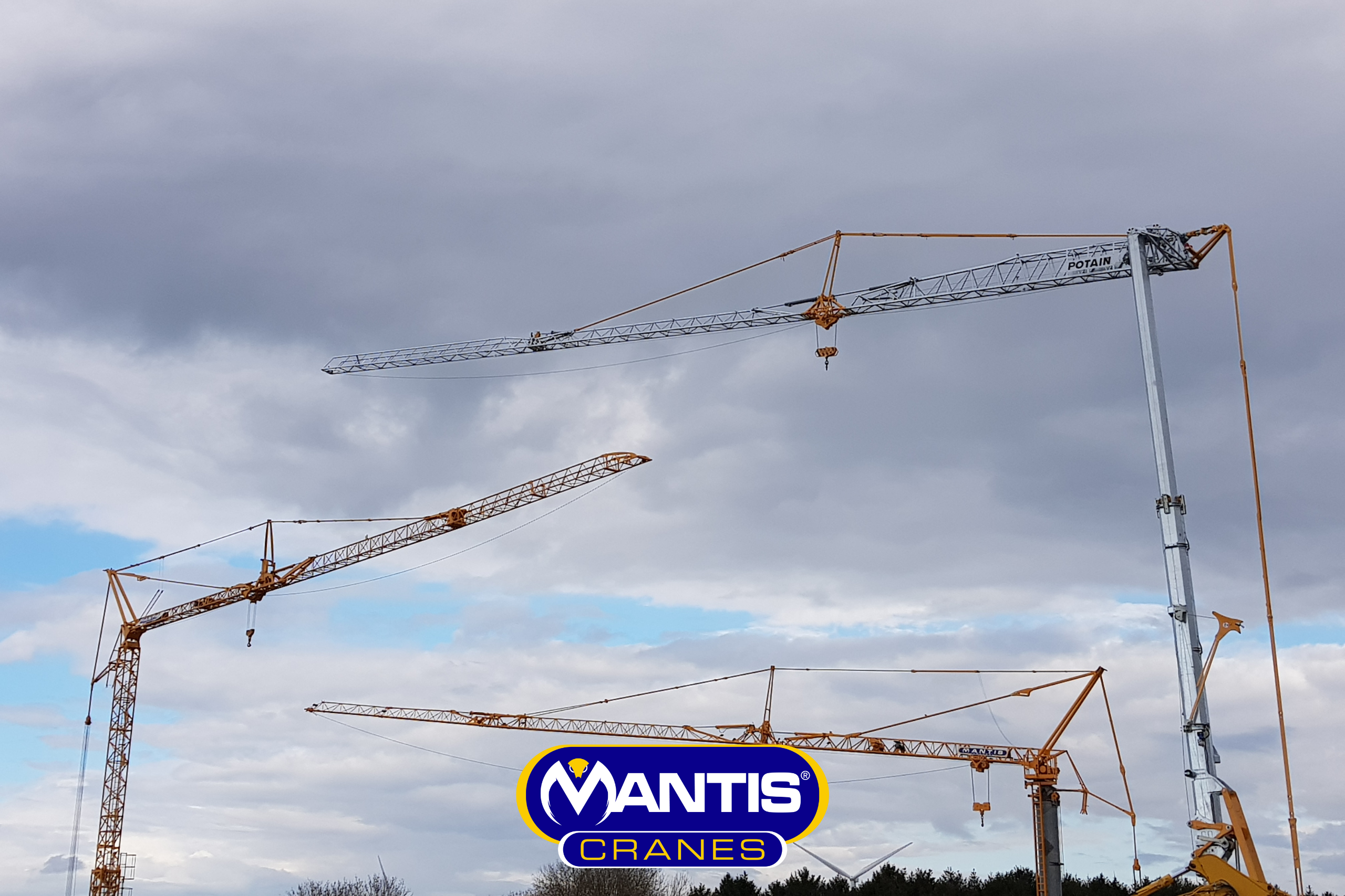 self erecting tower cranes A photo of 3 self erector cranes