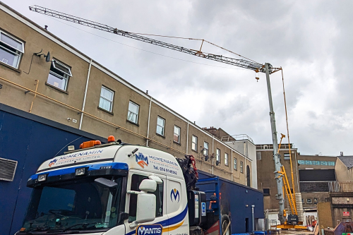 A photo of a self erector from Potain being installed on site