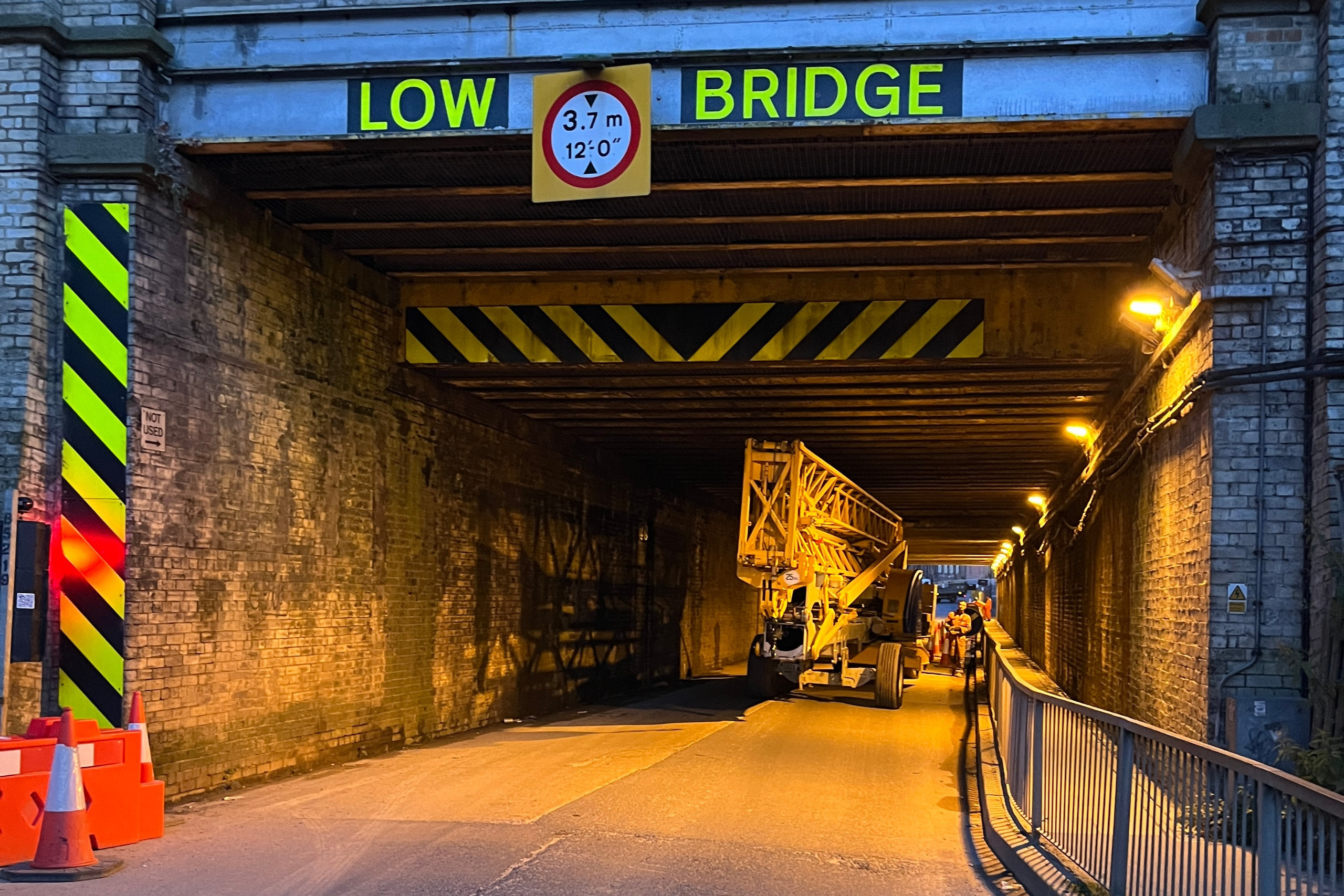 self erecting tower crane rental A photo of a mantis self erecting tower crane travelling under a low bridge.