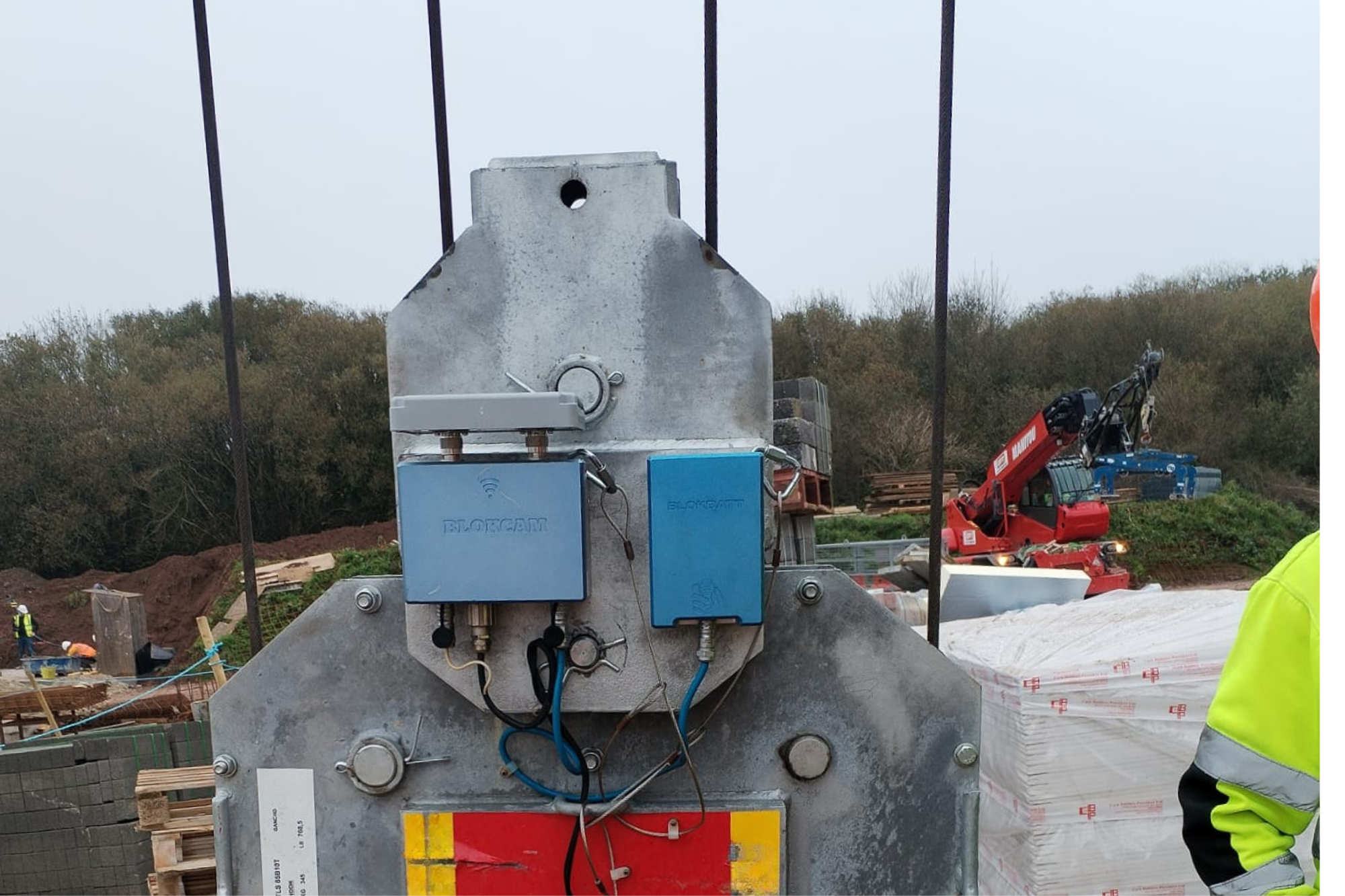 A photo of a tower crane hook camera attached to the crane hook