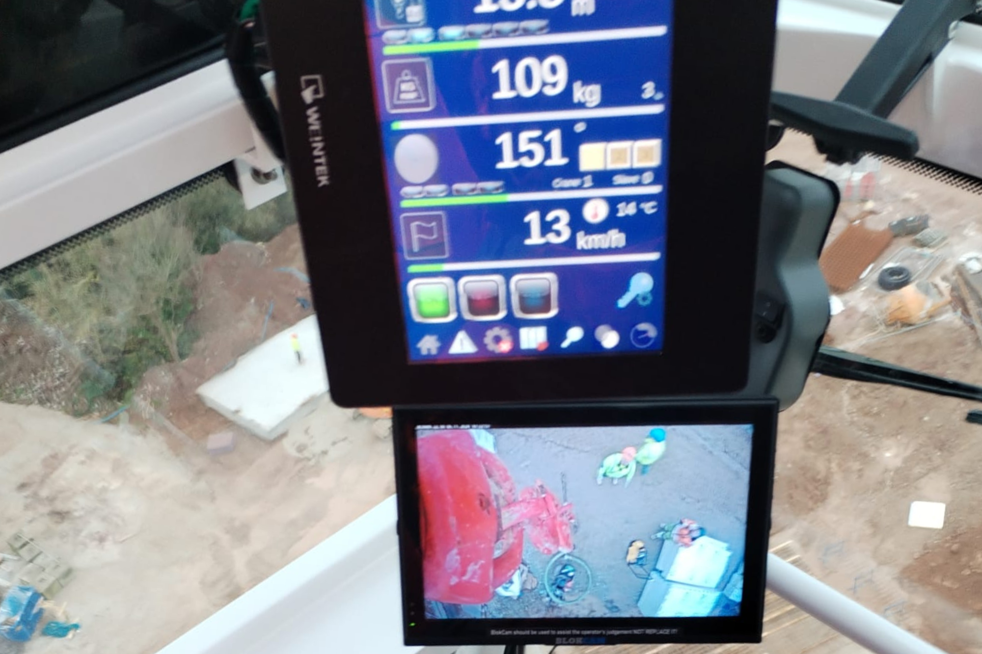 A photo of a tower crane hook camera monitor.