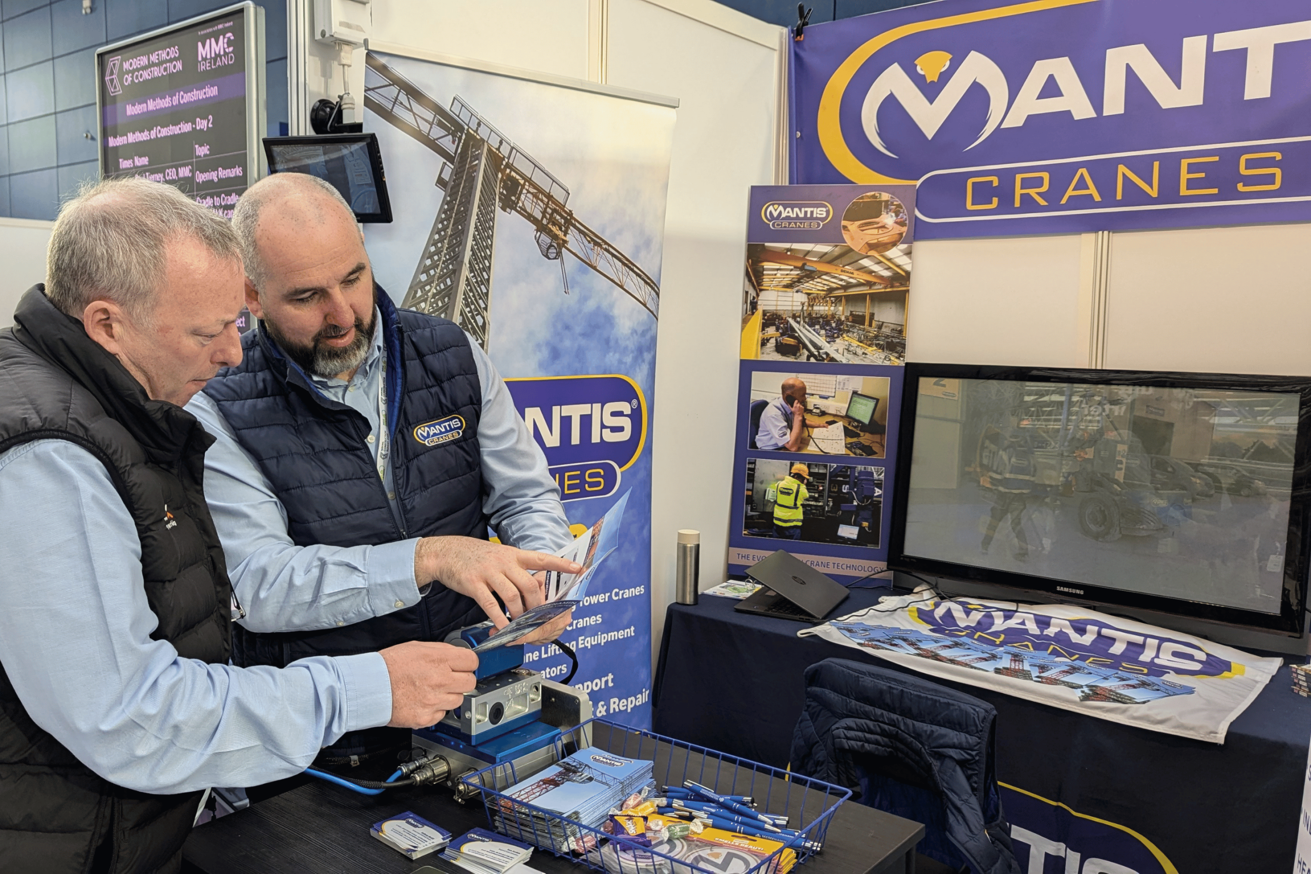 crane hire ireland A photo of the Mantis Cranes stand at a construction trade show in 2025