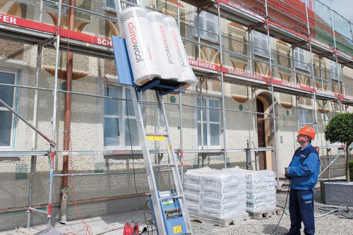 a photo of insulation being lifted with a geda rope hoist